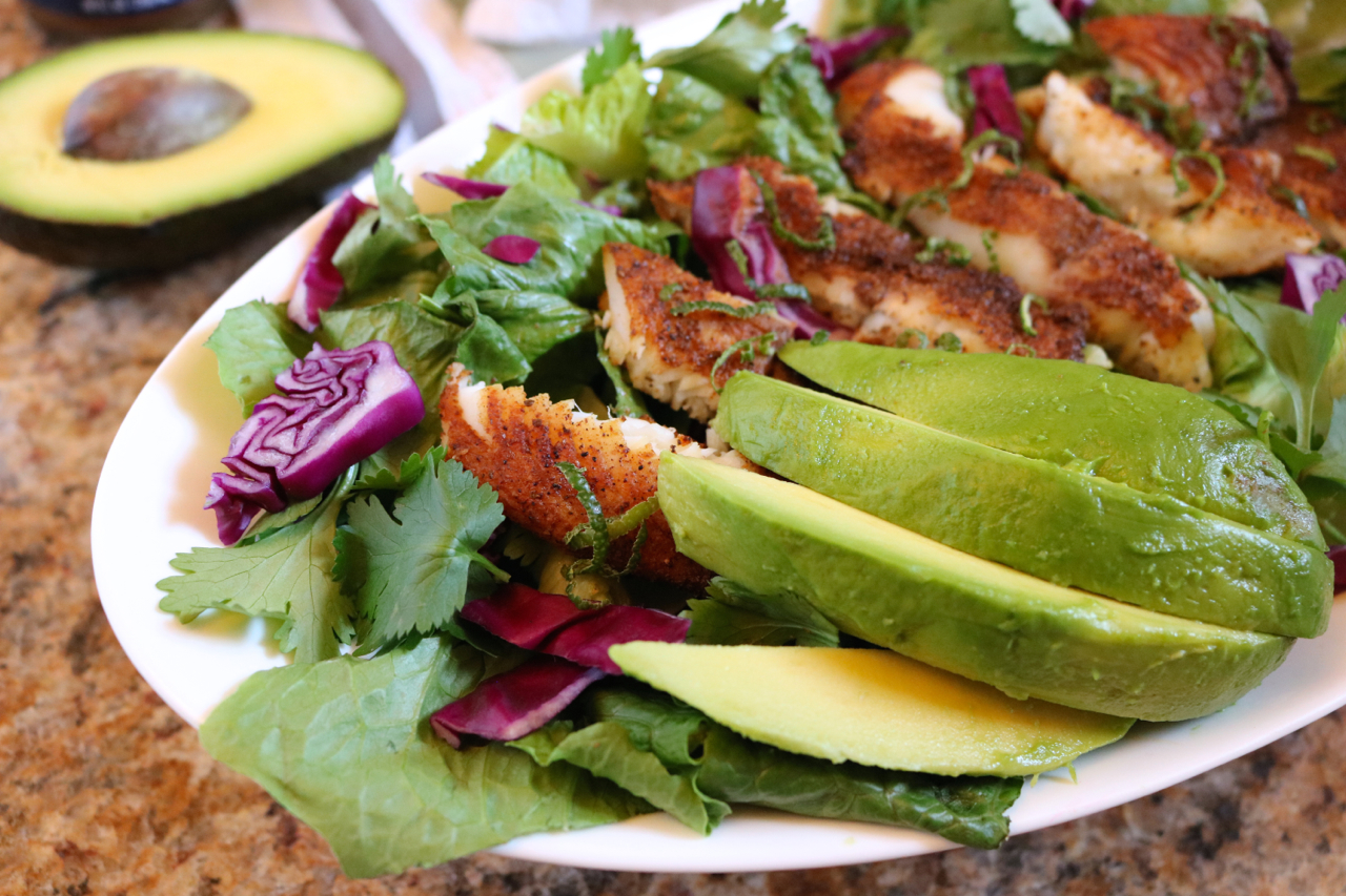 Blackened Tilapia Salad | Inspired by fish tacos, this salad swaps the tortilla with healthy greens for a low carb, paleo friendly dish. | eatsomethingdelicious.com