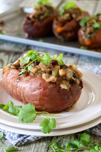 Moroccan Chicken Stuffed Sweet Potatoes | Chicken, apricots, and eggplant seasoned with a unique blend of herbs and spices then stuffed into a baked sweet potato. Paleo with a vegan option. | eatsomethingdelicious.com