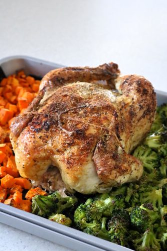 Roasted chicken and vegetables that are easy enough to make on a weeknight. Use frozen vegetables like sweet potato and broccoli to minimize prep work | eatsomethingdelicious.com