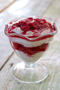 "Peanut" Butter & Jelly Chia Pudding | This peanut-free chia pudding uses flavor inspiration from a classic PB&J. Sunbutter flavors the pudding which is layered with a basic raspberry sauce. | eatsomethingdelicious.com