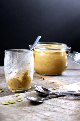 Partially eaten chia pudding in a mini dessert cup.