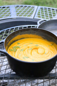 Open Fire Carrot Curry Soup | Spicy carrot curry soup cooked outdoors over an open fire. This soup is vegan, gluten free, and paleo. | eatsomethingdelicious.com