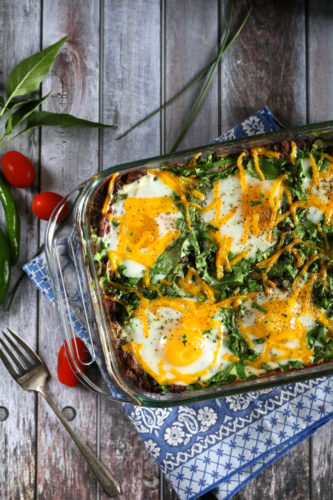 Black Bean & Potato Breakfast Casserole | A hearty breakfast casserole with layers of roasted potatoes, seasoned black beans, greens, eggs, and dairy free cheese. Omit eggs for vegan option. | eatsomethingdelicious.com