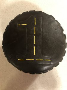 Allen's Tire Birthday Cake | Learn how to decorate a cake using only gluten free ingredients. I made this vanilla cake decorated in a tire tread pattern for my son's first birthday. | eatsomethingdelicious.com