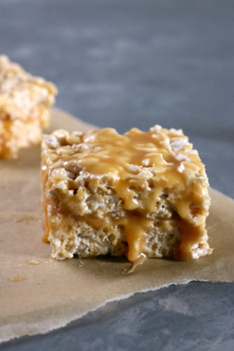 Caramel Stuffed Crispy Rice Treats | Easy crispy rice treats stuffed with a layer of runny caramel. You'll never believe they're free from dairy and gluten. Recipe includes a vegan option too. | eatsomethingdelicious.com