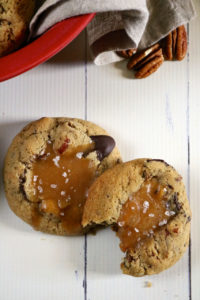Salted Caramel Filled Turtle Cookies | Soft baked gluten free turtle cookies with chocolate and pecans are dented in the center to make room for lots of dairy free salted caramel sauce! | eatsomethingdelicious.com